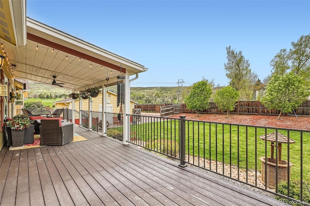 15325 W 32nd Ave, Golden, CO 80401 - wooden terrace with a fenced backyard, ceiling fan, outdoor dining area, and a yard