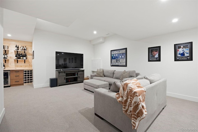 living room with bar, light colored carpet, and beverage cooler