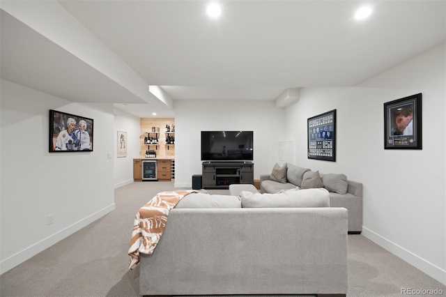 living room with wine cooler, bar area, and light carpet