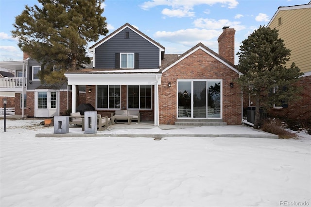 view of snow covered house