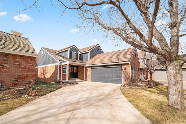 view of front of house with a garage and a front yard