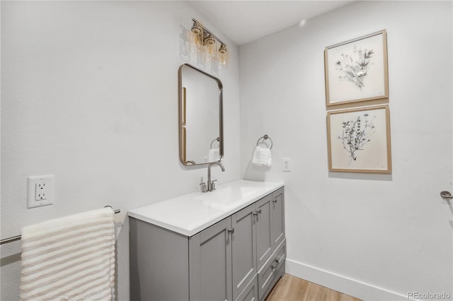 bathroom featuring vanity and hardwood / wood-style flooring