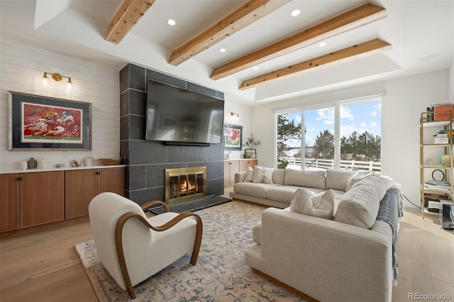 7079 S Locust Pl, Centennial, CO 80112 - living area with light wood-style floors, recessed lighting, beam ceiling, and a fireplace