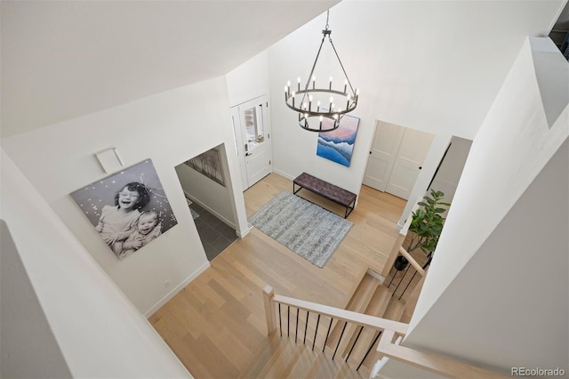7079 S Locust Pl, Centennial, CO 80112 - foyer featuring wood finished floors and a notable chandelier