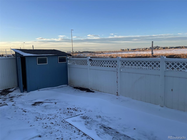 view of yard layered in snow