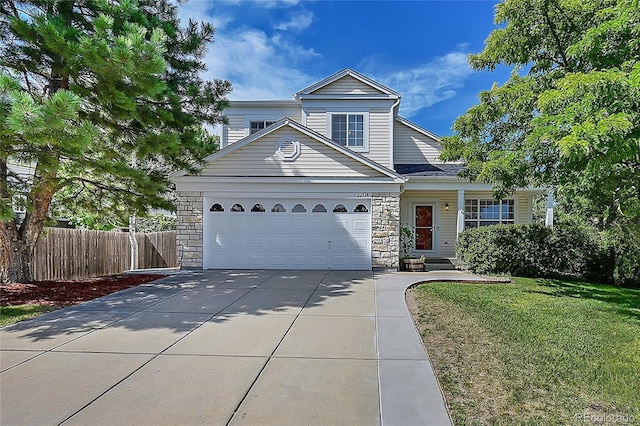 view of front property with a garage and a front lawn