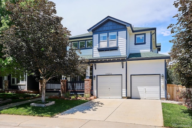10955 Dearborne Dr, Parker, CO 80134 - craftsman house with a garage, concrete driveway, a shingled roof, and a porch
