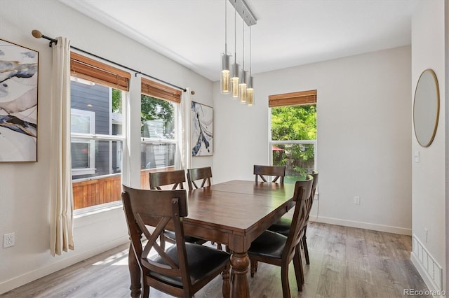 10955 Dearborne Dr, Parker, CO 80134 - dining area with light wood-style flooring and a chandelier