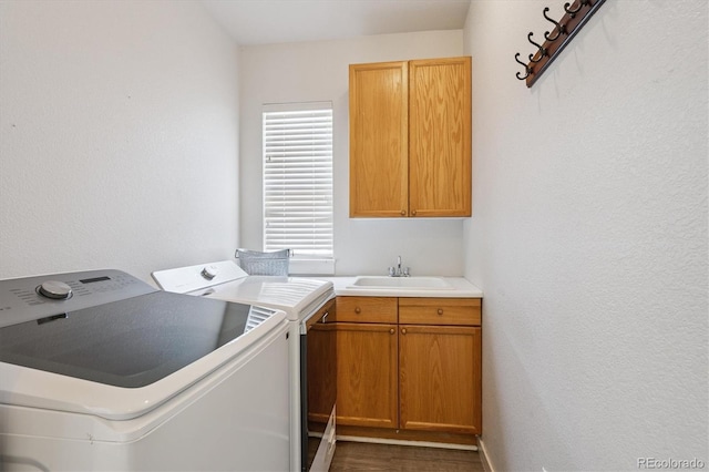 10955 Dearborne Dr, Parker, CO 80134 - laundry room featuring washing machine and clothes dryer, cabinet space, and dark wood-style floors
