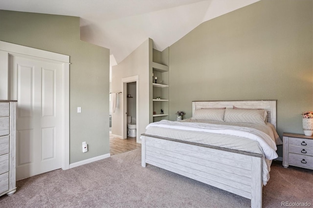 10955 Dearborne Dr, Parker, CO 80134 - bedroom featuring carpet flooring, vaulted ceiling, and connected bathroom