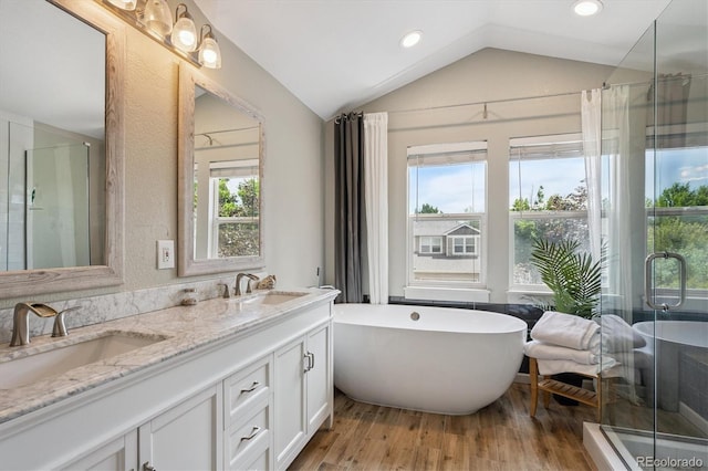 10955 Dearborne Dr, Parker, CO 80134 - full bath with vaulted ceiling, double vanity, plenty of natural light, a shower stall, and recessed lighting