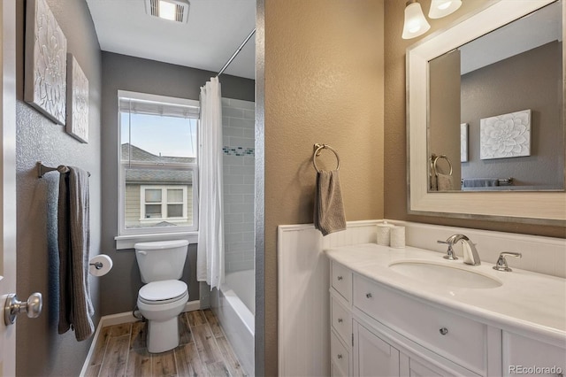 10955 Dearborne Dr, Parker, CO 80134 - bathroom with vanity, wood finished floors, shower / bathtub combination with curtain, and a textured wall