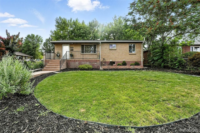 2025 Otis St, Edgewater, CO 80214 - view of front of home featuring brick siding and a front lawn