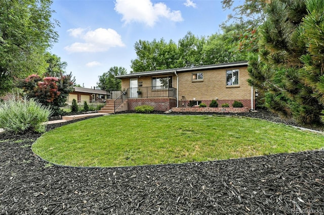2025 Otis St, Edgewater, CO 80214 - view of front of property featuring brick siding and a front yard