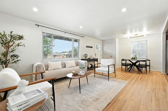 2025 Otis St, Edgewater, CO 80214 - living area with light wood-style flooring, plenty of natural light, and recessed lighting