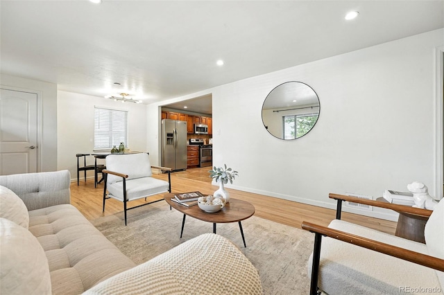 2025 Otis St, Edgewater, CO 80214 - living area with light wood-style flooring and recessed lighting