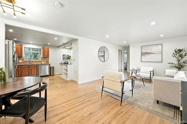 2025 Otis St, Edgewater, CO 80214 - living room with light wood finished floors and recessed lighting