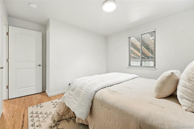 2025 Otis St, Edgewater, CO 80214 - bedroom with light wood-style floors and baseboards