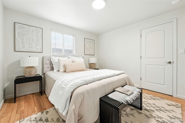 2025 Otis St, Edgewater, CO 80214 - bedroom with light wood-type flooring and baseboards