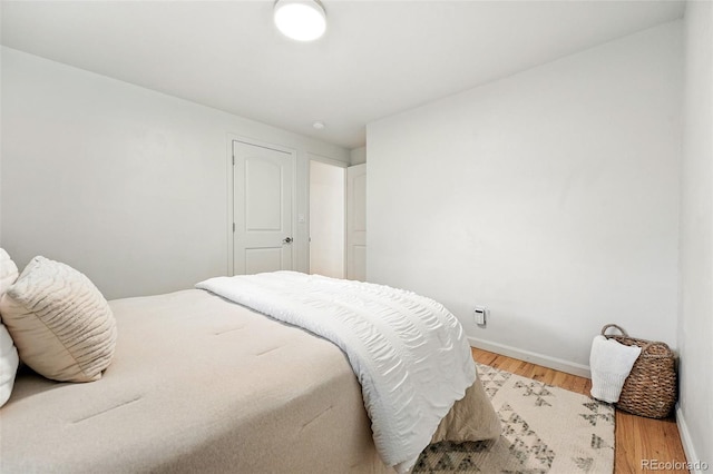 2025 Otis St, Edgewater, CO 80214 - bedroom with light wood-type flooring and baseboards