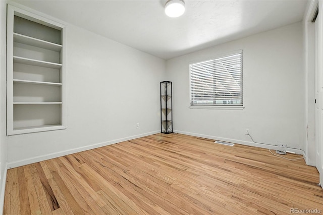 2025 Otis St, Edgewater, CO 80214 - empty room with wood finished floors and baseboards