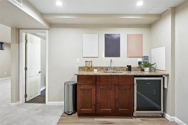 2025 Otis St, Edgewater, CO 80214 - indoor wet bar with beverage cooler, light wood-style flooring, and recessed lighting