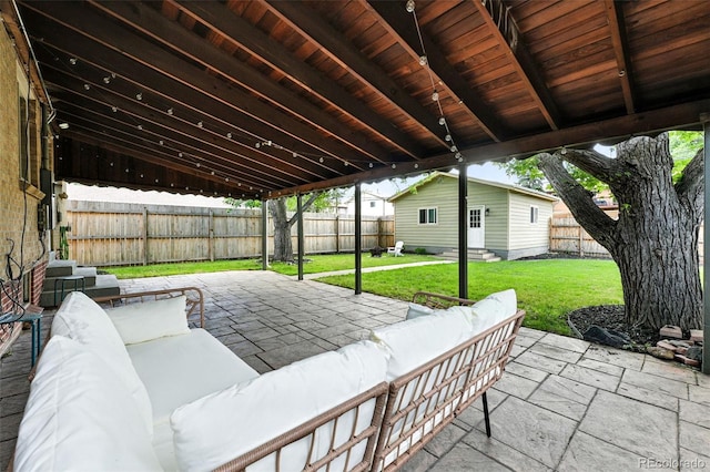 2025 Otis St, Edgewater, CO 80214 - fenced backyard featuring an outdoor living space, a patio, and entry steps