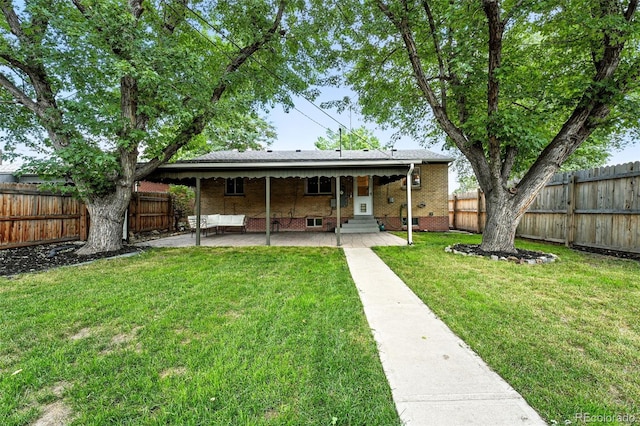 2025 Otis St, Edgewater, CO 80214 - back of house with a patio, a fenced backyard, entry steps, and brick siding