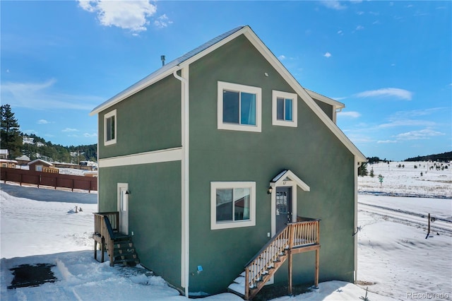 view of snow covered property