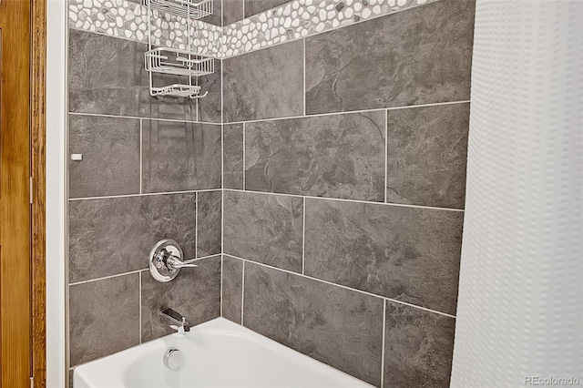 details with tiled shower / bath combo