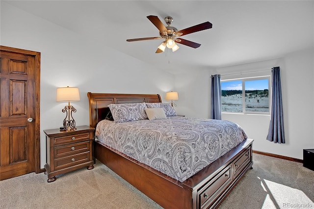 bedroom featuring light colored carpet and ceiling fan