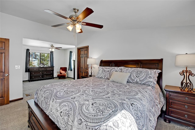 bedroom with ceiling fan and light carpet