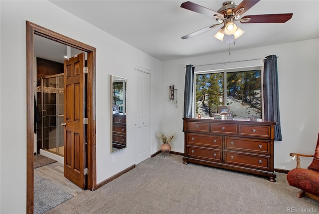 sitting room featuring ceiling fan and light carpet