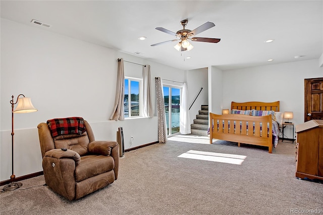 bedroom with ceiling fan and carpet floors