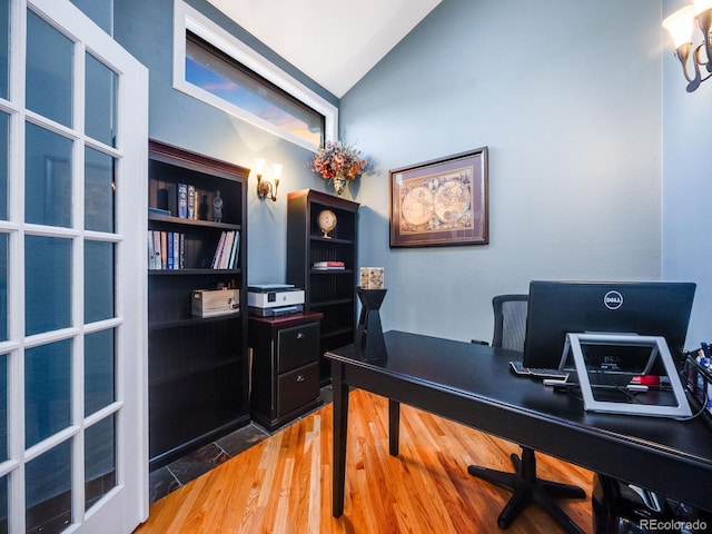 office area featuring lofted ceiling and hardwood / wood-style flooring