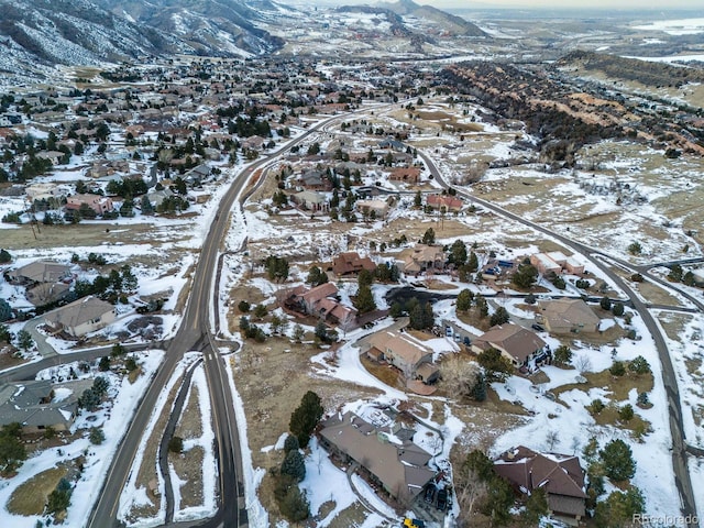 snowy aerial view featuring a mountain view