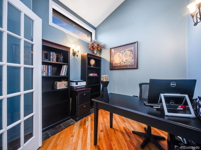office featuring vaulted ceiling and wood finished floors