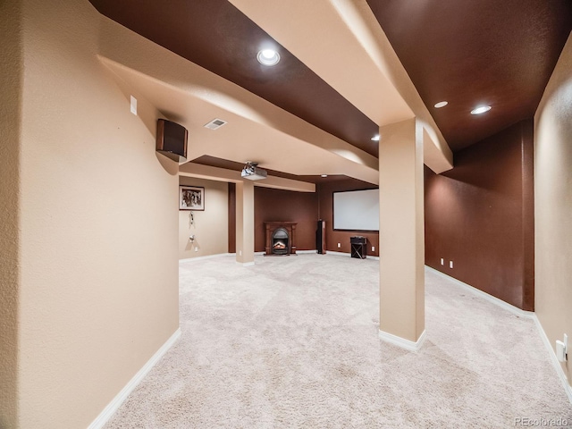 finished basement with carpet floors, baseboards, and recessed lighting