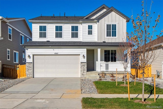 craftsman-style home featuring a porch, a garage, and a front lawn