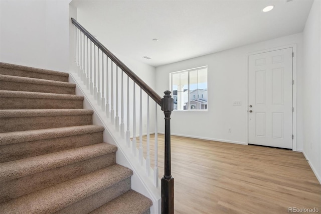 entrance foyer with hardwood / wood-style floors