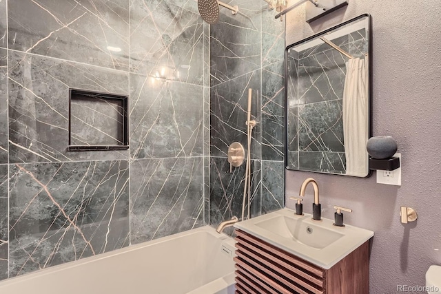 bathroom featuring vanity and shower / bath combo