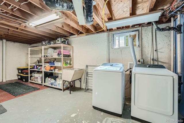 basement with washing machine and dryer