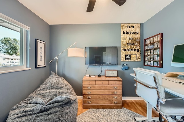 office space featuring wood-type flooring and ceiling fan