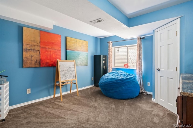 living area featuring dark colored carpet