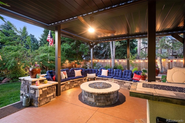 view of patio / terrace featuring an outdoor living space with a fire pit