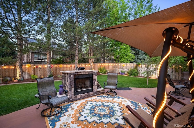 view of patio / terrace with an outdoor stone fireplace