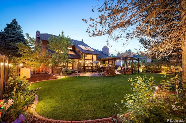 view of yard with a pergola and a patio area