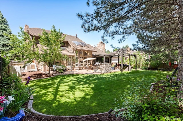 view of yard with a pergola and a patio