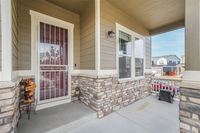 view of exterior entry with covered porch