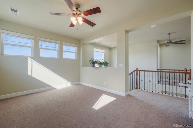 unfurnished room featuring light colored carpet